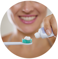 woman-applying-thoothpaste-to-brush